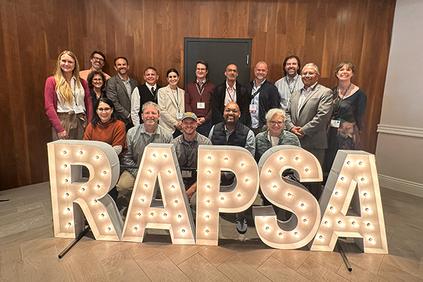 award recipients behind the rapsa sign